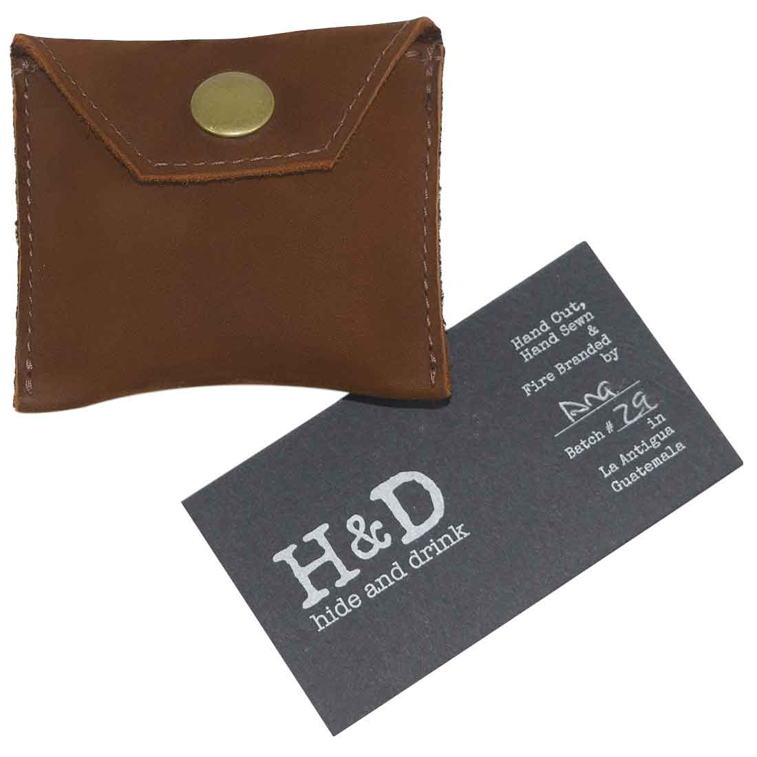 Hide & Drink Tampon Case in durable brown leather, designed for discreet storage of personal items. This handmade pouch showcases artisan quality from La Antigua Guatemala.