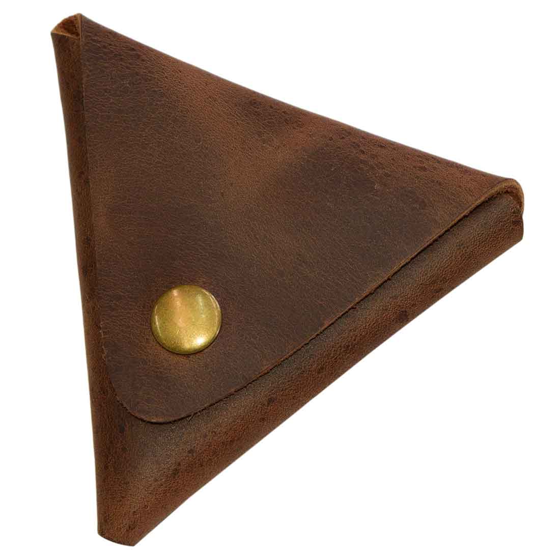 Closed view of Triangle Coin Pouch by Hide & Drink, featuring a durable press fit closure. This Triangle Coin Pouch is made from Full Grain Leather, ideal for storing cash, cords, and other small items. Emphasizing artisan quality and small batch production, this item is hand cut, hand sewn, and fire branded, made in La Antigua Guatemala & Oaxaca Mexico.