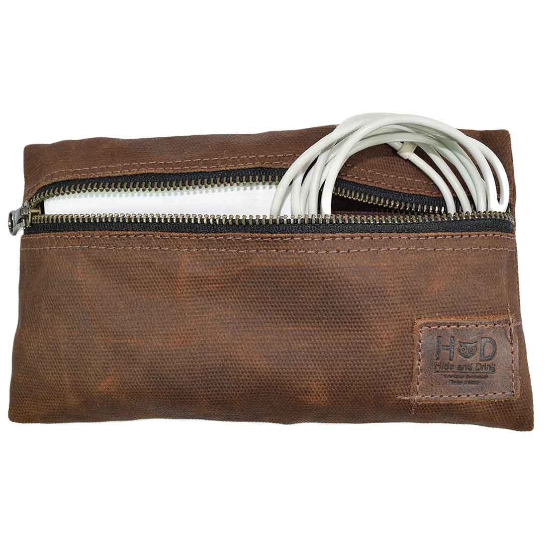 Hide & Drink Utility Cord Pouch shown in a captivating angle, emphasizing its durable leather. Ideal as an all-purpose utility & charger case for MacBook, iPad & Laptop, it also functions as a stylish cable organizer, hand-cut and sewn in La Antigua Guatemala & Oaxaca Mexico.